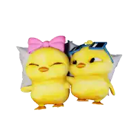 a couple of yellow chickens standing next to each other with one wearing a pink bow and sunglasses