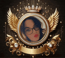 a picture of a woman in a gold frame with wings and a crown on top