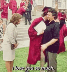 a man in a graduation cap and gown is hugging a woman in a white dress and says i love you so much .