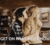 a picture of two women kissing with the words get on phas right now below them