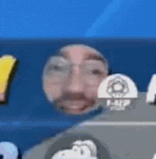 a close up of a man 's face with glasses and a beard in a video game .