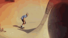 a person riding a skateboard down a ramp with a helmet on