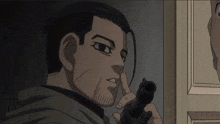 a man with a beard holds a gun to his nose