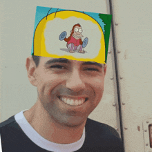 a man has a picture of a monkey lifting weights on his head