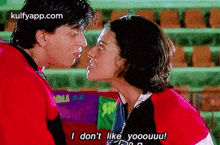 a man and a woman are kissing and the woman is saying `` i do n't like you ! ''
