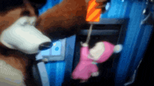 a little girl in a pink dress is being pulled up by a teddy bear