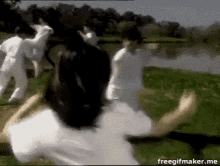 a group of people are running in a field with the words freegifmaker.me at the bottom of the screen