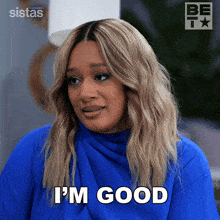 a woman says i 'm good in a blue shirt