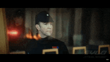 a man in a star wars uniform is standing in front of a window