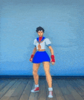 a girl in a blue skirt and red shoes is dancing
