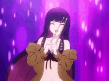 a girl with long black hair is holding a pair of sticks in her hands