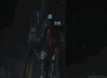 a man in a daredevil suit is standing on a staircase