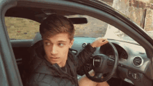 In The Car Looking Back GIF