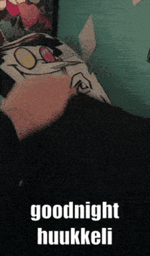 a person laying on a bed with the words goodnight huukeli on the top