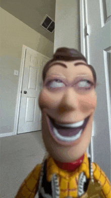 a toy story woody doll is making a funny face while standing in front of a door .