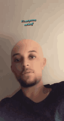 a bald man with the words it 's not gonna cut itself above his face