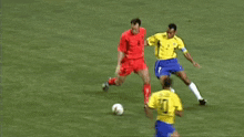 a soccer player wearing a number 10 jersey kicks the ball
