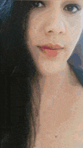 a close up of a woman 's face with a pink lip