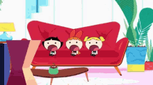 three cartoon characters sitting on a red couch with their mouths open .