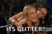 two women are hugging each other with the words `` its glitter ! ''