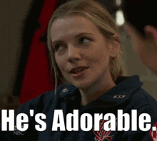 a woman says he 's adorable while looking at a man