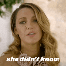 a close up of a woman 's face with the words she didn 't know above her