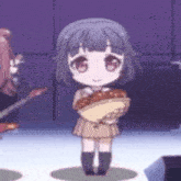 a little girl with short hair is holding a bowl of food .