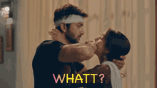 a man is kissing a woman on the cheek and the woman is saying whatt ?