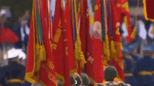 a bunch of red flags with a yellow stripe that says ' a ' on them