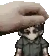a pixel art of a hand putting something on a person 's head .