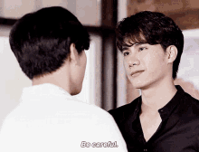 two men are standing next to each other and one of them is saying be careful