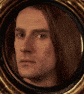 a close up of a man 's face in a round frame