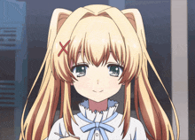 a girl with blonde hair has a red x on her head