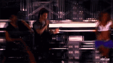 a man singing into a microphone with rbd.gif written on the bottom right