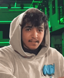 a young man wearing a hoodie with the word nb on it