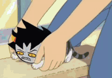 a cartoon of a person holding a cat 's head in their hands