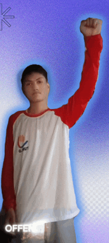a man with his fist in the air wearing a shirt that says " o'out "