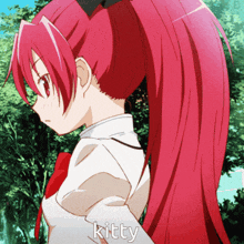 a girl with red hair has the word kitty on her sleeve