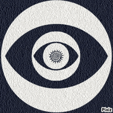an optical illusion of an eye in a circle with a spiral inside of it .