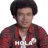 a man wearing a plaid shirt has the word hola on his chest