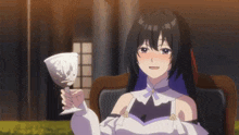 a girl is sitting in a chair holding a glass of wine .