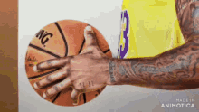 a man holding a basketball with the number 3 on it