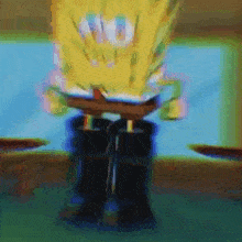 a blurry picture of spongebob squarepants standing on a table with his legs crossed .