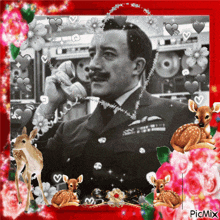 a picture of a man talking on a phone is surrounded by deer and roses