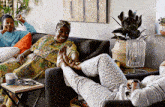 a woman sitting on a couch with her feet up