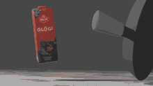 a bottle of marli glogi is being thrown in the air
