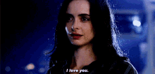 a close up of a woman 's face with the words `` i love you '' written on her face .