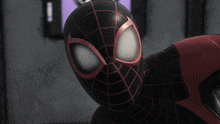a close up of a black and red spider man 's face