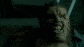 a close up of a man 's face with a beard and teeth