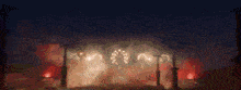 a blurred image of a fireworks display in the sky at night .
